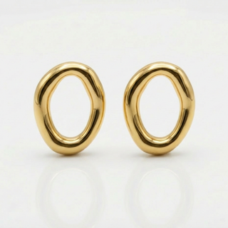 Pair of gold earrings on a white background