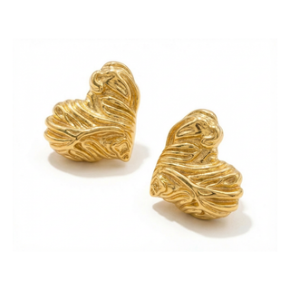 Pair of gold earrings on a white background