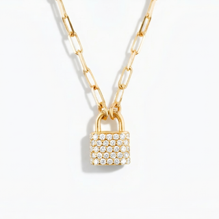 Gold necklace with a lock-shaped pendant on a white background