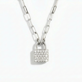 Silver padlock-shaped pendant with clear stones on a chain against a white background