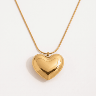 Amara Puffy Heart Pendant Necklace in gold, on a white background, front view
