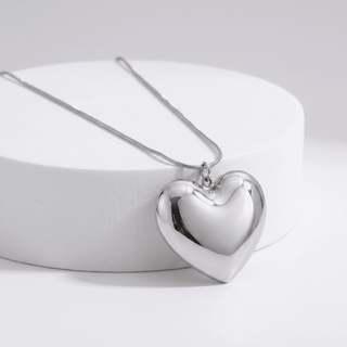 Amara Puffy Heart Pendant Necklace in silver, on a white background, front view