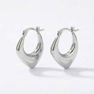 Pair of silver hoop earrings on a white background