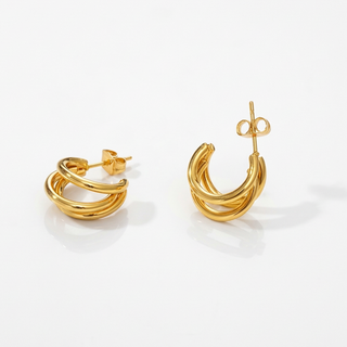 Pair of gold hoop earrings on a white background