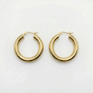 Gold hoop earrings on a white background