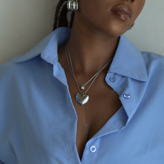 Amara Puffy Heart Pendant Necklace in silver, worn on model, wide shot
