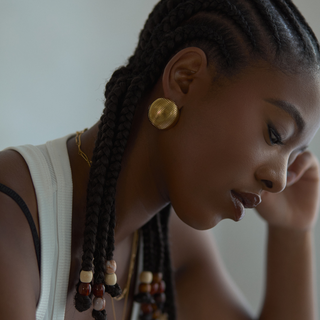 Della Dome Stud Earrings worn on model, wide shot