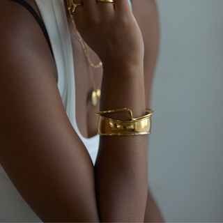 Mara Molten Cuff Bracelet worn on model, wide shot with layered jewellery