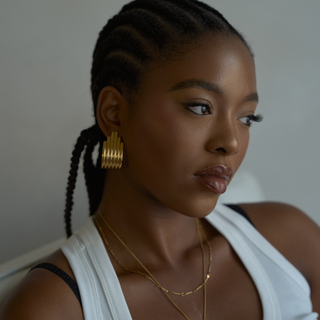 Thea Stacked Ridge Hoop Earrings worn on model, wide shot